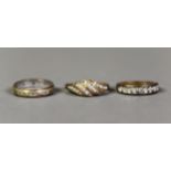 THREE 9ct GOLD RINGS, viz an eternity ring set with tiny diamonds; a ring with a four row spiral