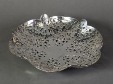 PIERCED SILVER SHALLOW DISH, of lobated form with floral pierced panels and ball feet, 2 ½” (6.