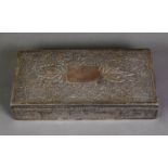 PROBABLY MALAYSIAN SILVER COLOURED METAL CLAD TABLE CIGARETTE BOX, of oblong form with slightly