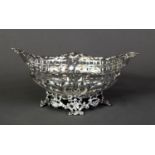 LATE VICTORIAN PIERCED SILVER BON BON DISH BY WILLIAM COMYNS, of elliptical form with shell capped