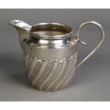 SILVER CREAM JUG, of wrythen fluted form with wire pattern scroll handle, 2 ½” (6.3cm) high, marks