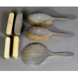 GEORGE V ENGINE TURNED SILVER BACKED FOUR PIECE DRESSING TABLE HAND MIRROR AND BRUSH SET,