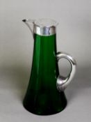 EDWARD VII SILVER MOUNTED GREEN GLASS CLARET JUG, by George Edwin Walton (G.E. Walton & Co. Ltd.)