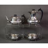 VINERS ‘CUTLERS TO THE KING’ FOUR PIECE ELECTROPLATED TEA SET, of oval panelled form with black