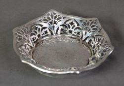 GEORGE V PIERCED SILVER BON BON DISH, of hexagonal outline with shaped rim and stylised floral
