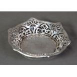 GEORGE V PIERCED SILVER BON BON DISH, of hexagonal outline with shaped rim and stylised floral