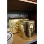 BRASS MAGAZINE RACK WITH RELIEF MOULDED INN SCENES, A BRASS BIN AND A SMALL BRASS TRIVET (3)