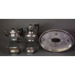 GEORGIAN STYLE FOUR PIECE ELECTROPLATED TEA SET, of part fluted, rounded oblong form with black