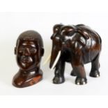 LARGE AFRICAN CARVED HARDWOOD MODEL OF AN ELEPHANT WITH BONE TUSKS AND DETAIL, 12" (30.5cm) HIGH AND