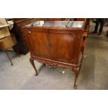 A REPRODUCTION MAHOGANY COCKTAIL CABINET