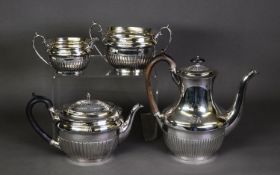 FOUR PIECE ELECTROPLATED TEA AND COFFEE SET, of semi-lobated, oval form with scroll handles and oval