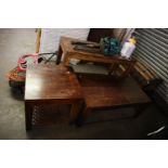 THREE INDONESIAN TEAK GRADUATED OCCASIONAL TABLES, WITH LATTICED LEATHER SHELF STRETCHERS, 18" X 47"