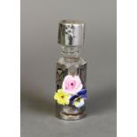 SMALL GLASS CYLINDRICAL PERFUME FLASK with pierced silver overlay and with applied porcelain posy of