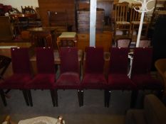 A SET OF SIX MODERN DINING CHAIRS, COVERED IN DARK RED VELVET FABRIC, HAVING DARK STAINED LEGS (A.