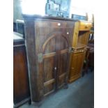 GEORGE III EARLY 19TH CENTURY LARGE OAK HANGING CORNER CUPBOARD, WITH TWO ARCH TOP DOORS