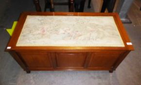 A MAHOGANY PANELLED BEDDING BOX, WITH TAPESTRY COVERED LID