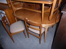 TEAK EXTENDING TABLE WITH FLIP-OVER LEAF, POSSIBLY BY NATHAN, WITH SIX DINING CHAIRS [7]