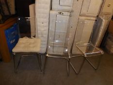 A SET OF THREE STYLISH DINING CHAIRS, HAVING TRANSPARENT PLASTIC SEAT AND CHROME BASE (3)