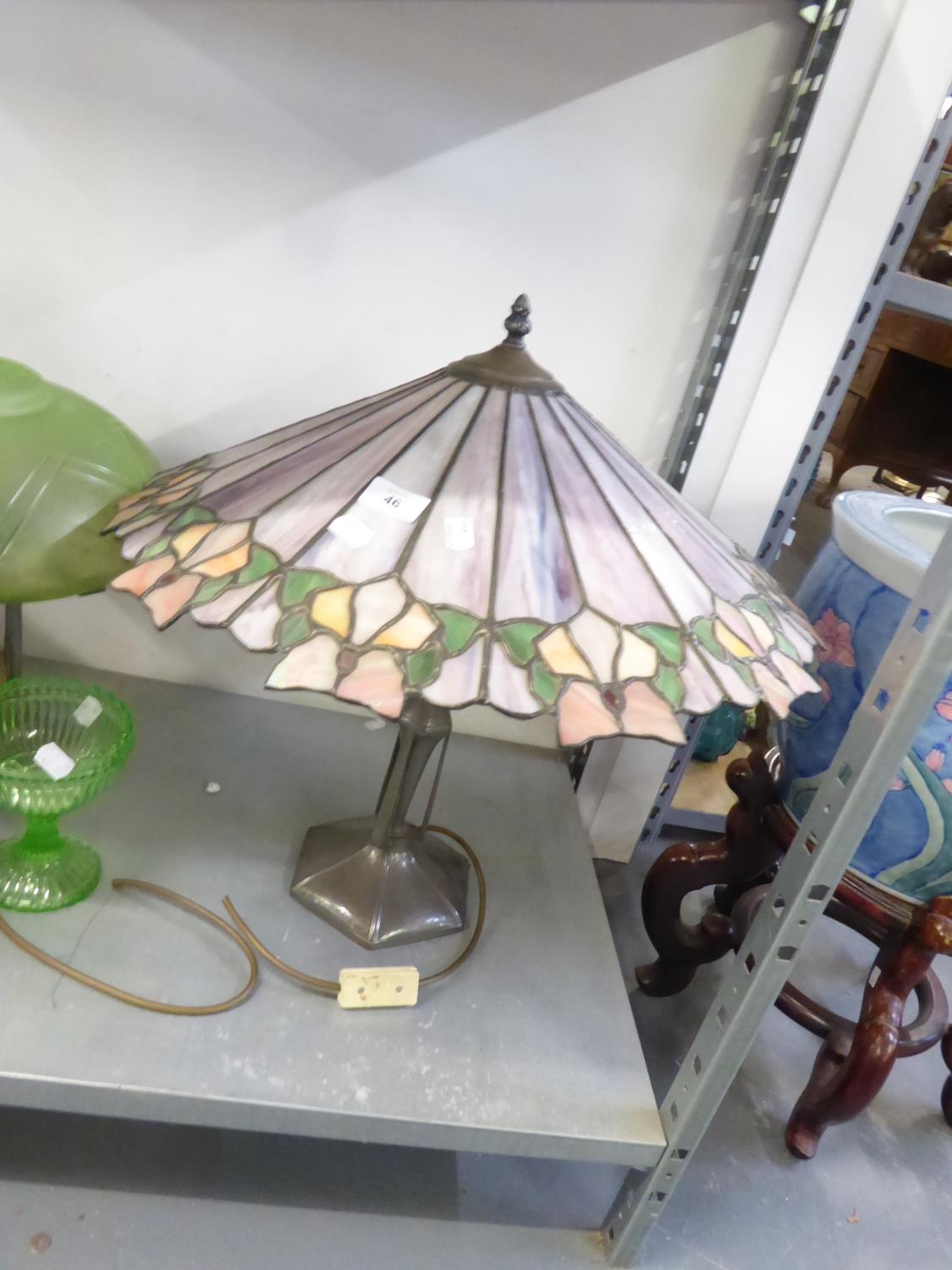 A BRONZE FINISH TIFFANY STYLE TABLE LAMP AND A CONICAL LEADED AND STAINED GLASS SHADE