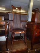 A SPINNING STICK BACK ARMCHAIR AND A WICKER IRON FRAMED CHAIR (2)