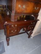 A 1930's JACOBETHAN LOWBOY, HAVING ONE LONG DRAWER ABOVE TWO SMALL DRAWERS