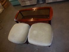 A PAIR OF UPHOLSTERED WOODEN AND CANE-WORK FOOTSTOOLS, ALSO A SIMILAR COFFEE TABLES WITH GLASS INSET