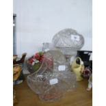 A CUT GLASS TABLE LAMP WITH CUT GLASS GLOBE SHADE AND A CUT GLASS BASKET PATTERN BLOW WITH HOOP