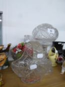 A CUT GLASS TABLE LAMP WITH CUT GLASS GLOBE SHADE AND A CUT GLASS BASKET PATTERN BLOW WITH HOOP