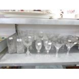 A SET OF 9 CUT GLASS COCKTAIL GLASSES, WHEEL ENGRAVED WITH ROSES, SEVEN CUT GLASS STEM WINE