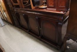 A REPRODUCTION VICTORIAN STYLE SIDEBOARD, HAVING THREW DRAWERS ABOVE THREE CUPBOARDS
