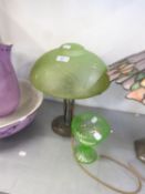 A METAL TABLE LAMP WITH DOMED GREEN FROSTED GLASS SHADE AND A GREEN GLASS PEDESTAL SUGAR BASIN (2)