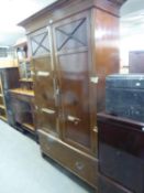 A GEORGE V MAHOGANY INLAID TWO DOOR WARDROBE, HAVING LARGE DRAWER TO THE BASE AND STEPPED CORNICE