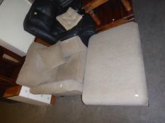 A GOOD QUALITY FAWN COLOURED ARMCHAIR AND MATCHING LARGE OBLONG FOOTSTOOL (2)