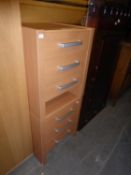 A PAIR OF MODERN BEECH THREE DRAWER BEDSIDE CHESTS