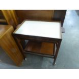 A MAHOGANY TEA TROLLEY WITH LIFT-OFF TRAY TOP, WITH CREAM FORMICA LINING