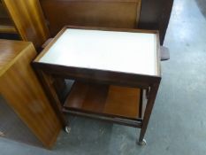 A MAHOGANY TEA TROLLEY WITH LIFT-OFF TRAY TOP, WITH CREAM FORMICA LINING