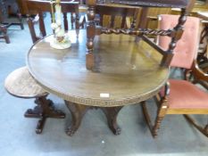 OAK CIRCULAR CENTRE TABLE WITH 'X' SHAPED PANELLED SUPPORTS WITH FOUR PAW FEET