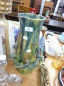 IMPRESSIVE MAJOLICA GLAZED AND MOULDED POTTERY VASE, with a row of six loop type handles to the