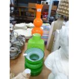 TWO 1970’s GREEN CASED AND MOULDED GLASS VASES, ANOTHER, TALLER, IN ORANGE, 18 ½” (47cm) high and