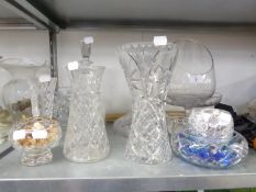 A LARGE CUT GLASS FLOWER VASE, A SMALLER VASE ON CIRCULAR FOOT, ANOTHER VASE, A CUT GLASS SHIPS