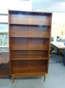 A TEAK SLOPING FRONT OPEN BOOKCASE, HAVING ADJUSTABLE SHELVES, BY B.M. OF DENMARK, 3'3" WIDE