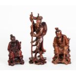 THREE CHINESE ROOT CARVINGS, two as seated fisherman (lacking rods) and another of a fisherman