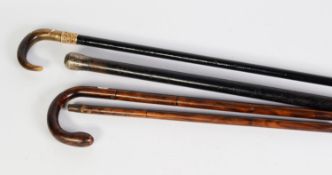 VINTAGE TWO-PART FOLDING WALKING CANE, having brass folding and sliding linkage and folding in half,