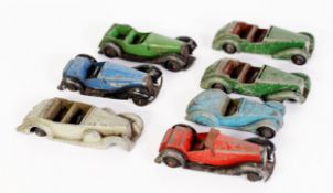 SEVEN DINKY TOYS - CIRCA 1940s DIE CAST SPORTS CARS, all in playworn and incomplete condition, all