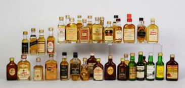 THIRTY NINE MAINLY VINTAGE MINIATURE BOTTLES OF BLENDED SCOTCH WHISKY, with levels on or over the