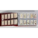 RING BINDER CONTAINING TEN SETS OF JOHN PLAYERS CIGARETTE CARDS including sets of military interest,