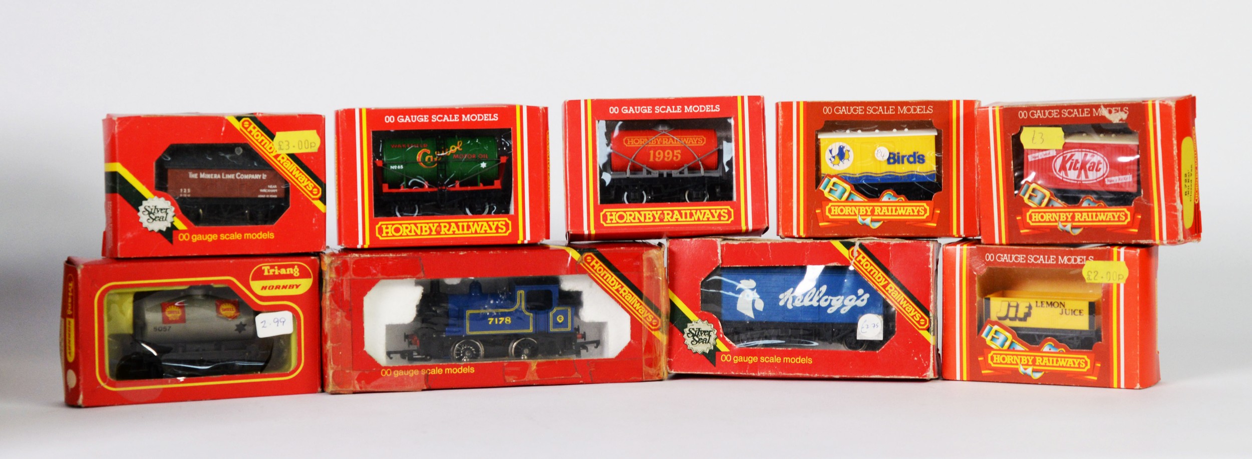 TWENTY FOUR HORNBY RAILWAYS BOXED ITEMS OF OO GAUGE GOOD ROLLING STOCK, together with a pair of