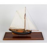 PAINTED WOOD MODEL OF THE SCILLY ISLES FISHING BOAT AGNES, under full sail, with solid wooden