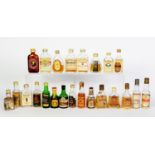 TWENTY THREE VINTAGE VARIOUSLY SHAPED MINIATURE BOTTLES OF MALT, BLENDED AND OTHER WHISKY BASED