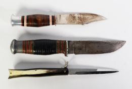 TWO SCOUT KNIVES, in leather sheaths and a CLASP KNIFE with horn mounted handle
